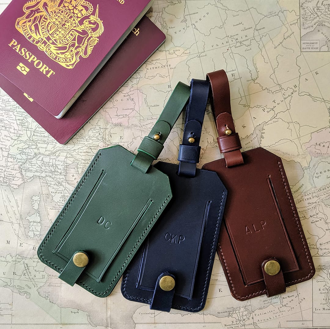 Personalised leather luggage tags in different colours.