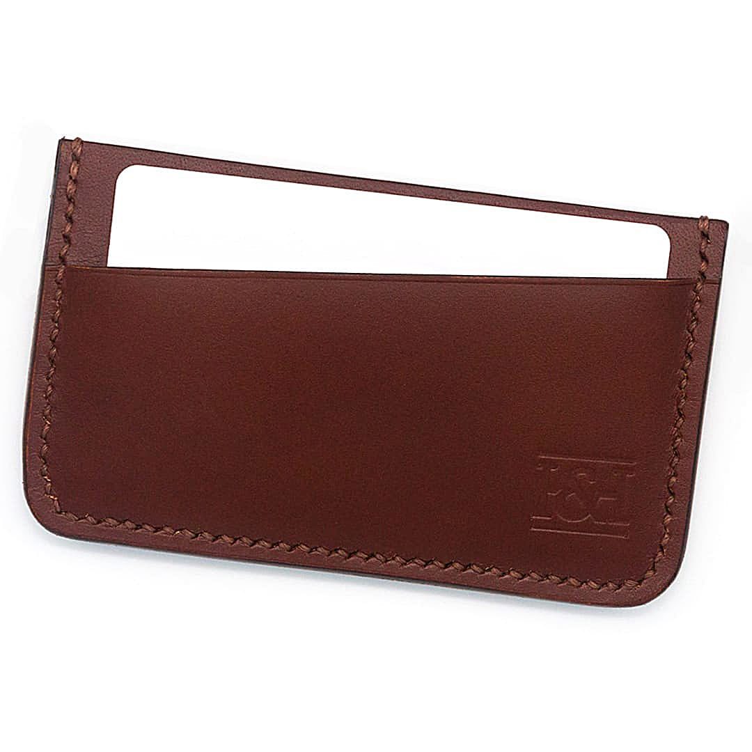 2 slot leather cardholder with sloped slots and cards.