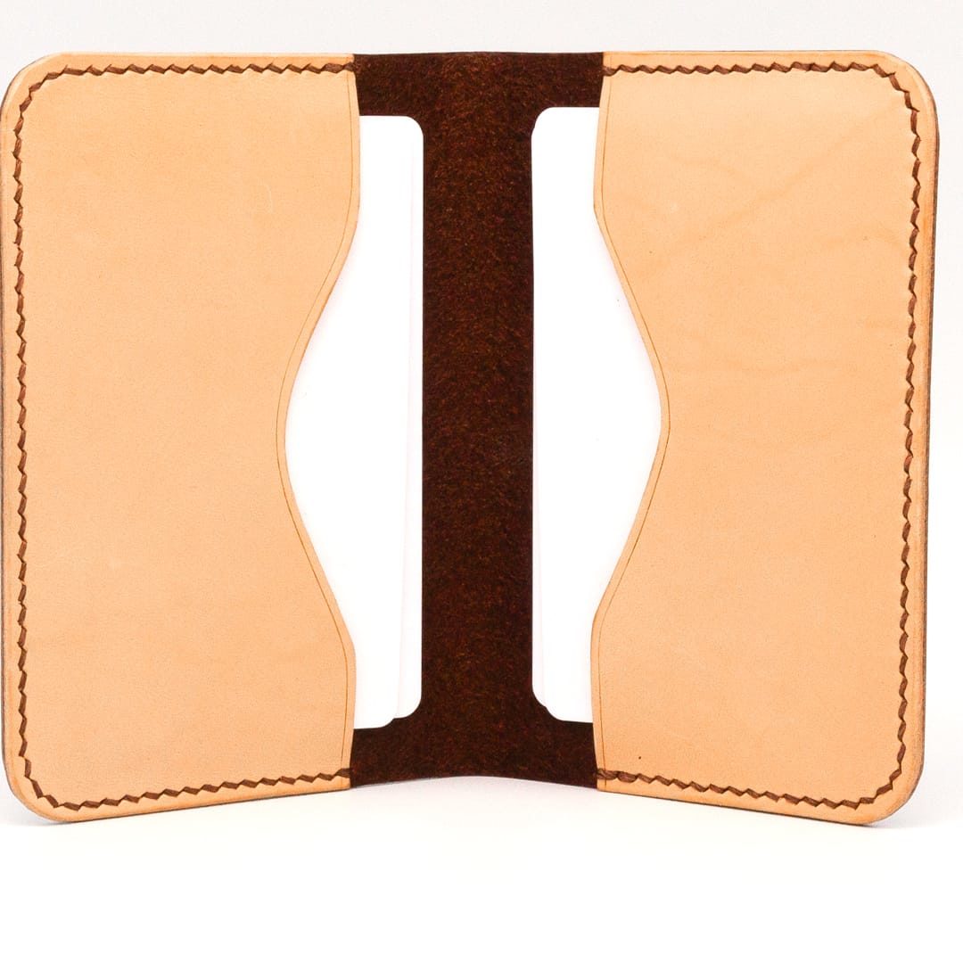 Inside of brown and nude folding cardholder, showing wave pockets and blank cards.